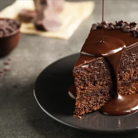 Indulge in the rich, decadent layers of our chocolate cake, topped with a smooth chocolate drizzle.
