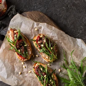 Enjoy the vibrant taste of Mediterranean toast, loaded with fresh toppings and a dash of olive oil.